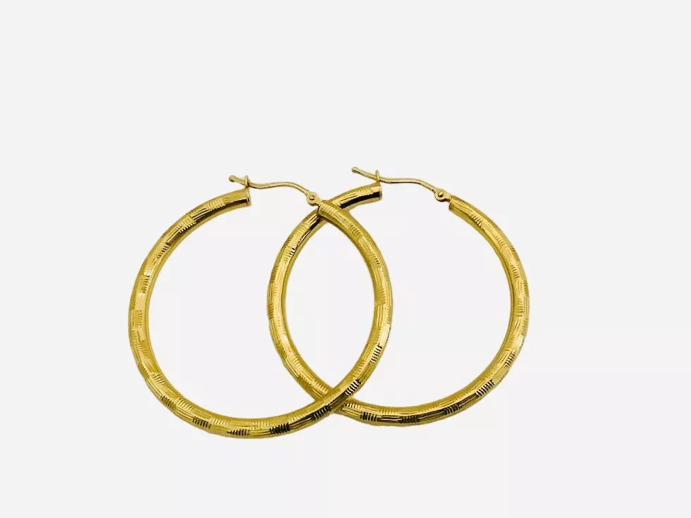 Italian gold medium size Shimmering hoop earrings 1.5”